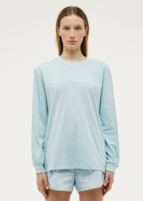 STREAMLINE LONG SLEEVE TOP IN WASHED SKY BLUE